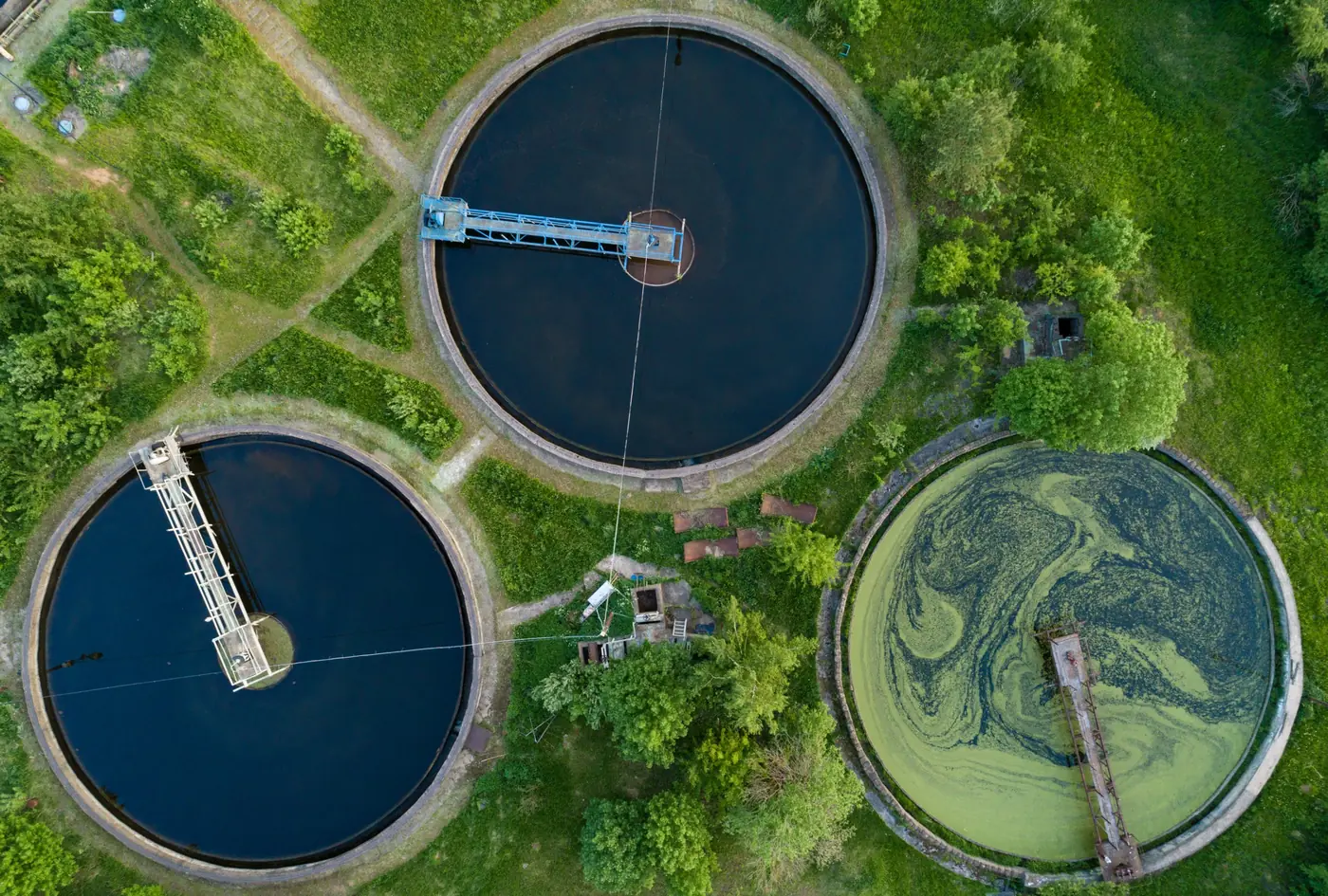 Aerial view of the circular tanks of a wastewater treatment plant